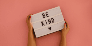 Blog post titled *Budgeting Kindness*, discussing the importance of incorporating kindness into daily life and how it fosters personal growth and spiritual well-being with Alisha Herrick of Earth Wise Coaching Orange County